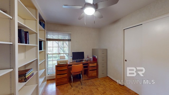 office area with ceiling fan and light parquet flooring