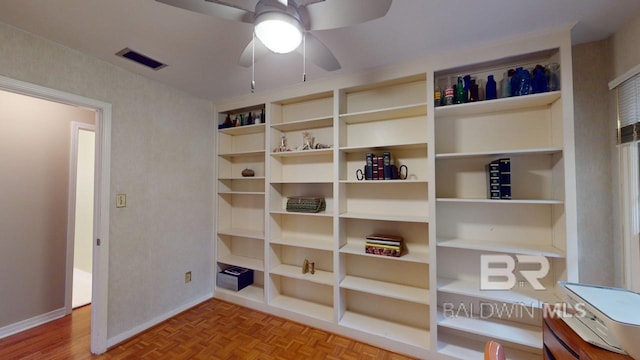 interior space featuring ceiling fan and light parquet floors