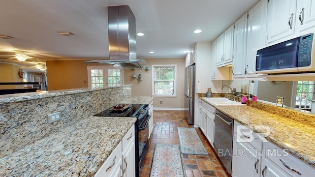 kitchen with sink, white cabinets, and stainless steel appliances