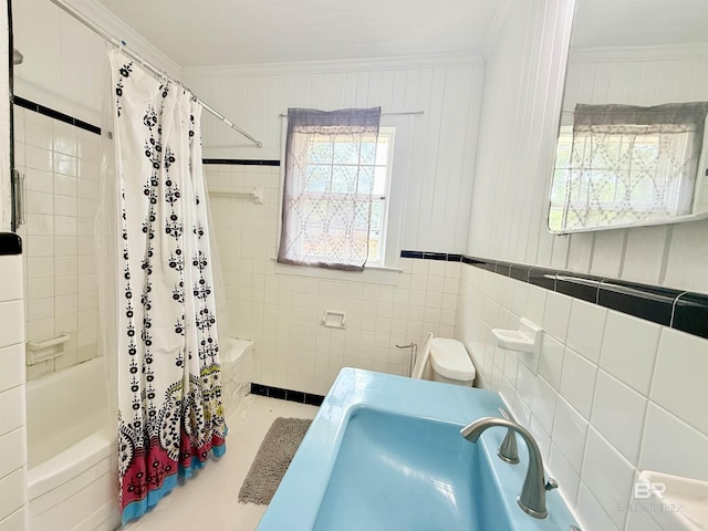 613 S Carney St, Atmore, AL 36502 - full bath with ornamental molding, shower / tub combo with curtain, and tile walls