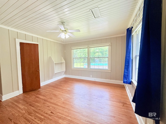 613 S Carney St, Atmore, AL 36502 - empty room featuring ornamental molding, light wood-style flooring, a ceiling fan, and wood ceiling