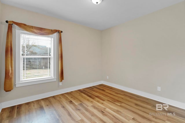 spare room featuring light hardwood / wood-style flooring