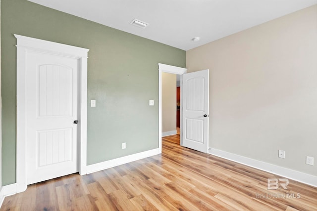 unfurnished bedroom featuring light hardwood / wood-style floors