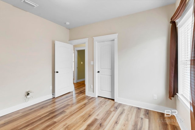 unfurnished bedroom with light hardwood / wood-style floors