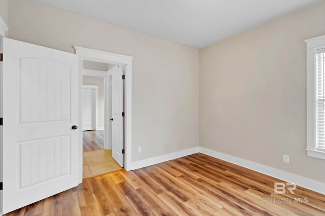 spare room featuring light wood-type flooring