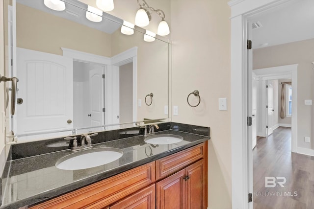 bathroom featuring vanity and wood-type flooring