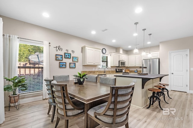 26635 Terry Cove Dr, Orange Beach, AL 36561 - dining room with light wood finished floors, baseboards, and recessed lighting