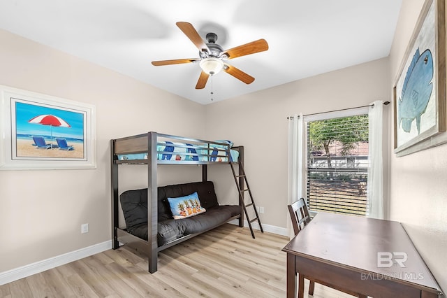 26635 Terry Cove Dr, Orange Beach, AL 36561 - bedroom with light wood finished floors, a ceiling fan, and baseboards