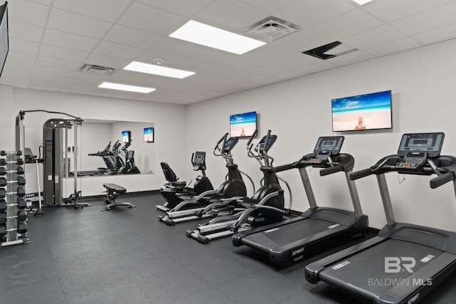 workout area featuring a paneled ceiling and visible vents