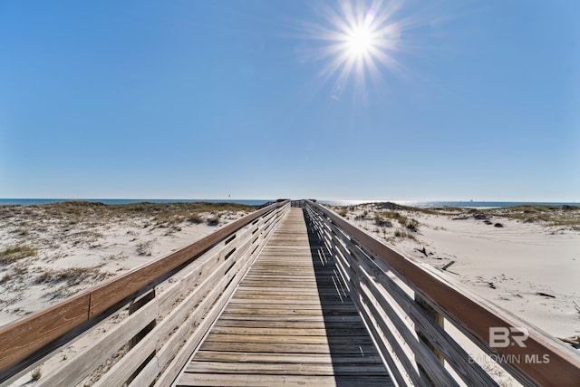 view of property's community featuring a view of the beach and a water view