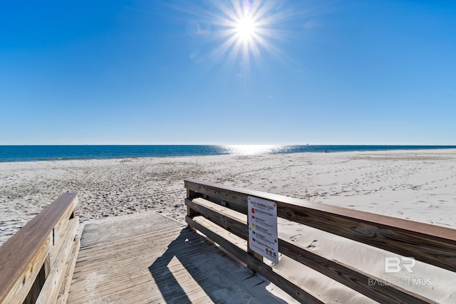 view of home's community featuring a water view and a view of the beach