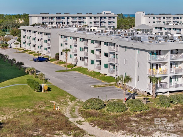 view of property featuring uncovered parking