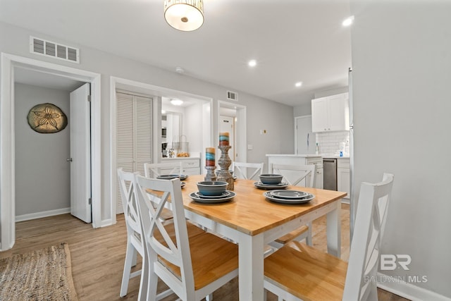 dining area with recessed lighting, visible vents, baseboards, and light wood finished floors