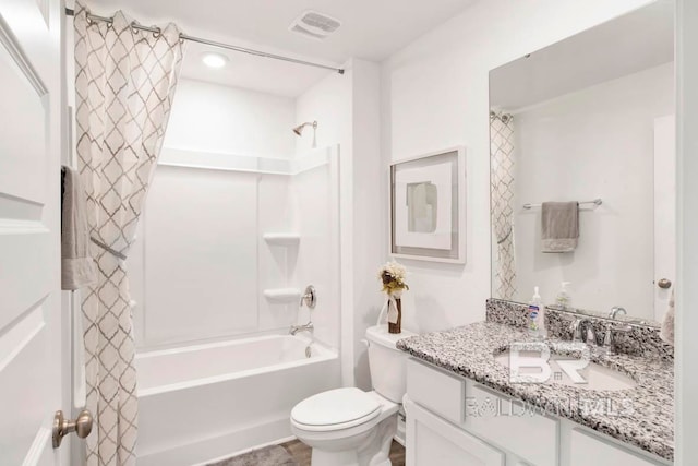 full bathroom with toilet, vanity, and shower / bath combo with shower curtain