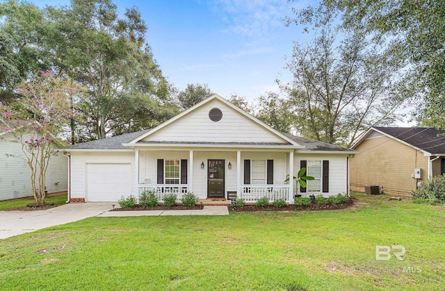 view of front of house featuring cooling unit, a front yard, covered porch, and a garage