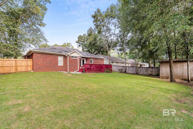 view of yard featuring a wooden deck