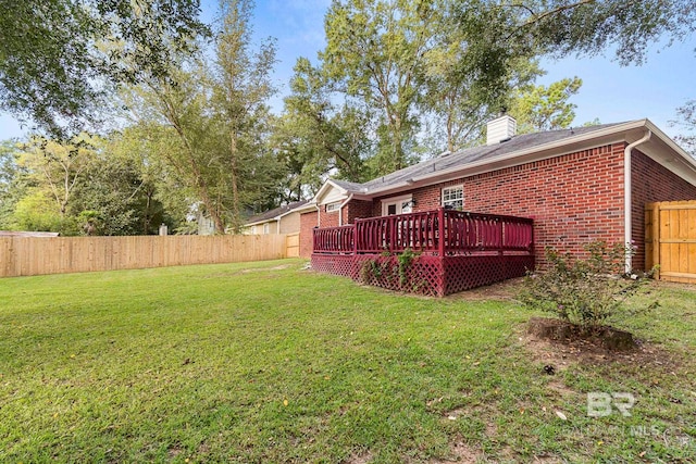 view of yard featuring a wooden deck