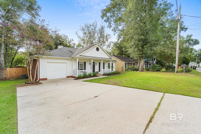 view of front facade featuring a garage, a front yard, and a porch