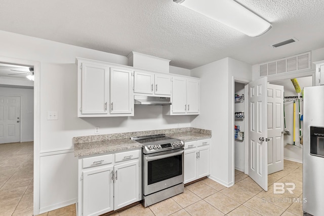 kitchen with white cabinetry, a textured ceiling, light tile patterned floors, stainless steel appliances, and ceiling fan