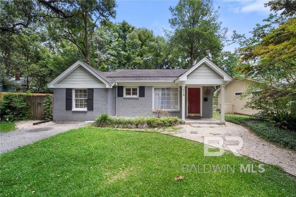 ranch-style house with a front lawn