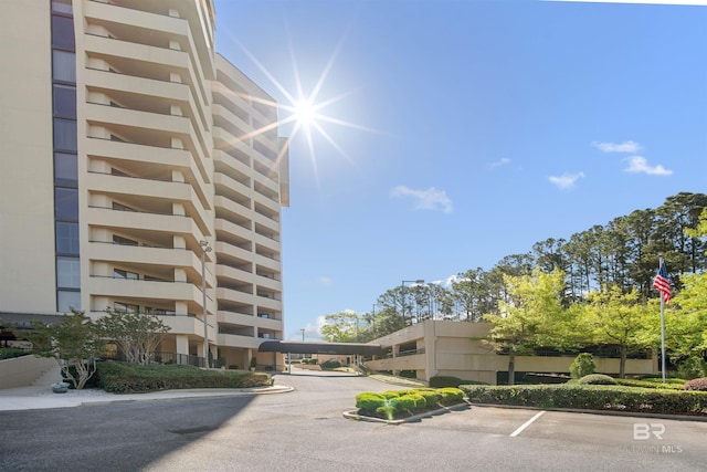 view of property featuring uncovered parking