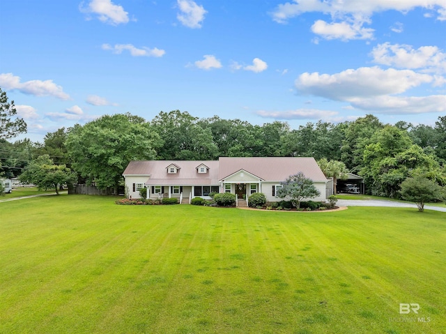 20011 Lawrence Rd, Fairhope, AL 36532 - view of front of house with a front yard, driveway, an attached garage, and metal roof