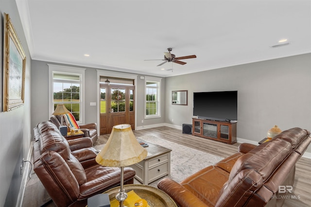 20011 Lawrence Rd, Fairhope, AL 36532 - living area with wood finished floors, plenty of natural light, ceiling fan, baseboards, and ornamental molding