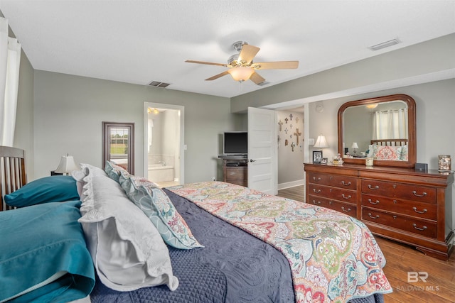 20011 Lawrence Rd, Fairhope, AL 36532 - bedroom with dark wood-style flooring, ceiling fan, and connected bathroom