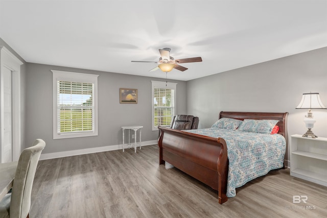 20011 Lawrence Rd, Fairhope, AL 36532 - bedroom featuring wood finished floors, a ceiling fan, and baseboards