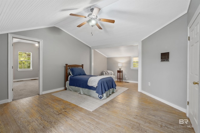 20011 Lawrence Rd, Fairhope, AL 36532 - bedroom with wood finished floors, vaulted ceiling, baseboards, and a ceiling fan