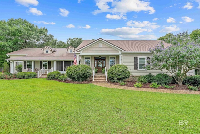 20011 Lawrence Rd, Fairhope, AL 36532 - view of front facade with covered porch, a front lawn, and metal roof