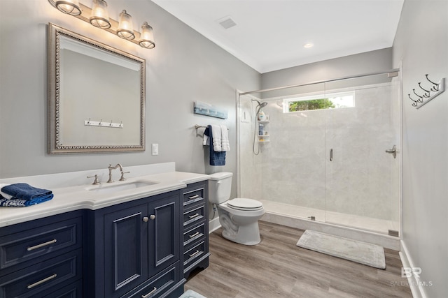 20011 Lawrence Rd, Fairhope, AL 36532 - bathroom with vanity, toilet, a stall shower, wood finished floors, and baseboards