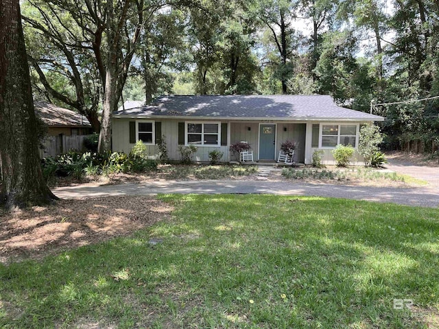 ranch-style house with a front lawn