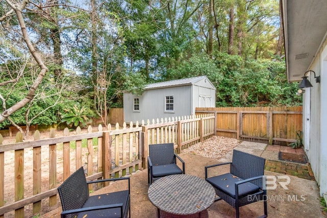 view of patio featuring a shed