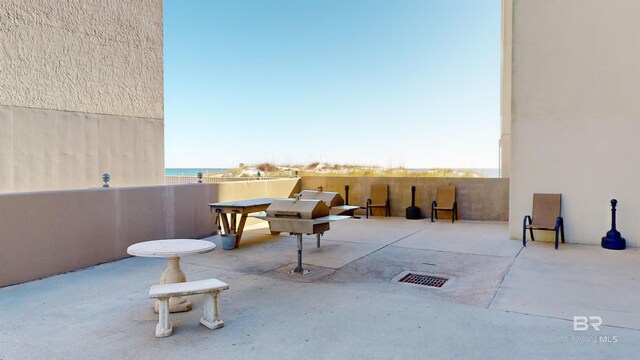 view of patio / terrace with a water view