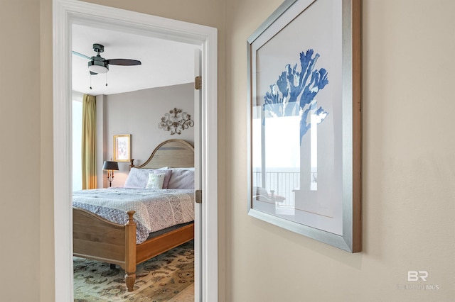 bedroom with multiple windows and ceiling fan