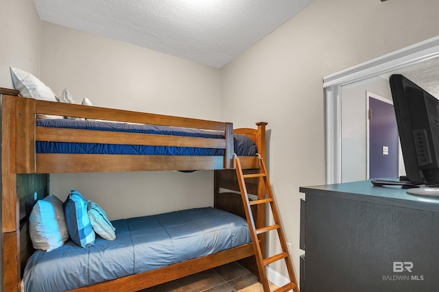 bedroom featuring a textured ceiling