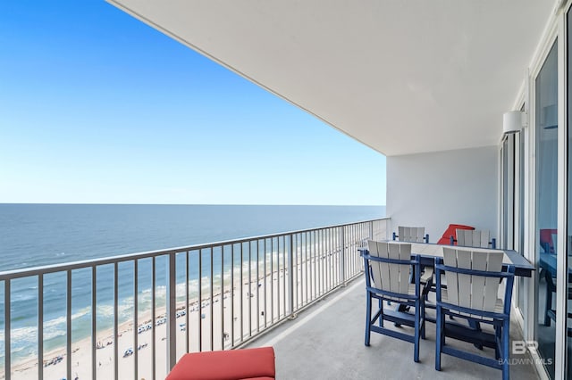 balcony featuring view of water and beach