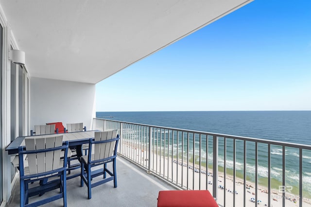 balcony featuring view of water and beach