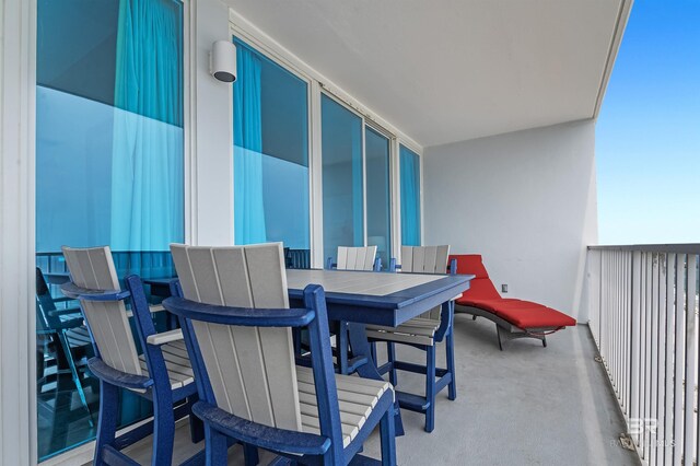 balcony featuring outdoor dining area