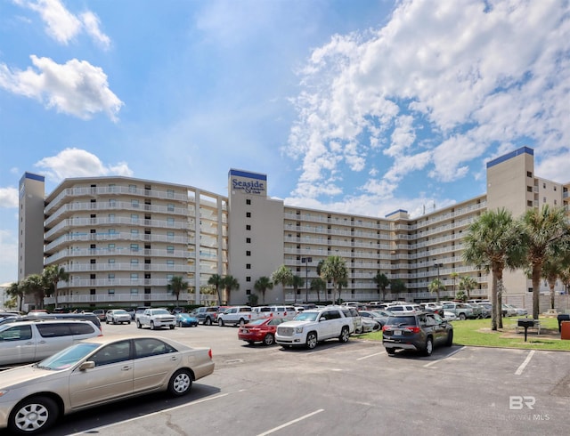 view of building exterior featuring uncovered parking