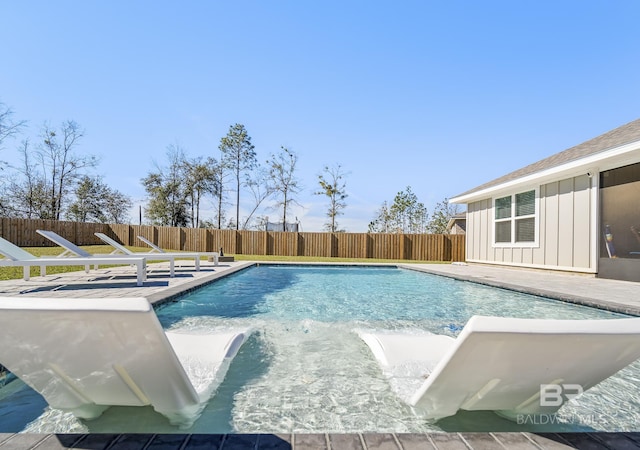 view of pool featuring a patio area, a fenced backyard, and a fenced in pool