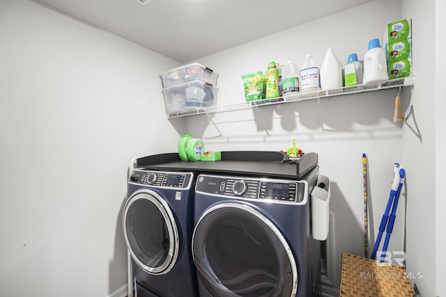 laundry area with laundry area and independent washer and dryer