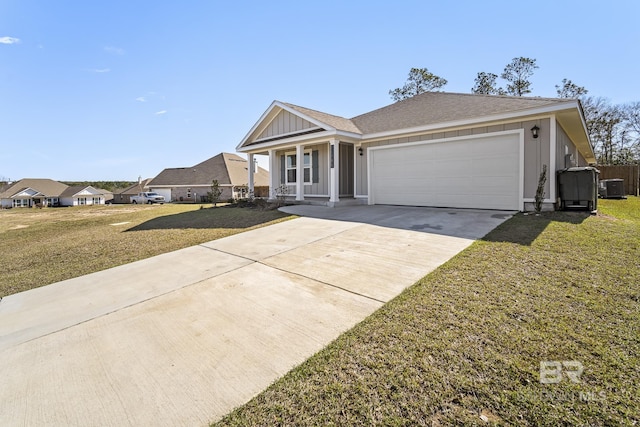 view of front of house with a shingled roof, concrete driveway, an attached garage, board and batten siding, and a front lawn