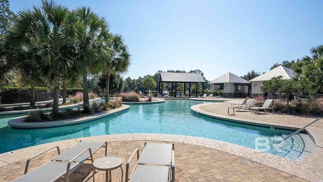 community pool featuring a patio, a gazebo, and fence