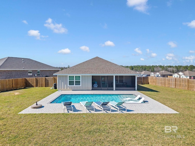 view of swimming pool with a patio area, a fenced backyard, and a yard