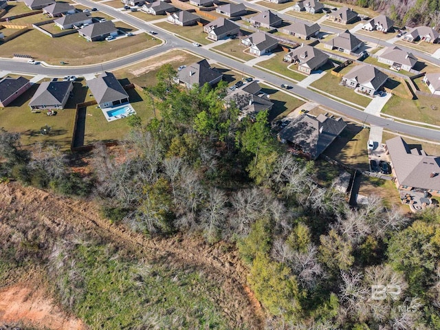 birds eye view of property with a residential view