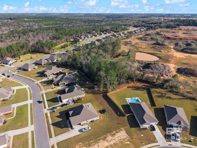 aerial view with a forest view and a residential view