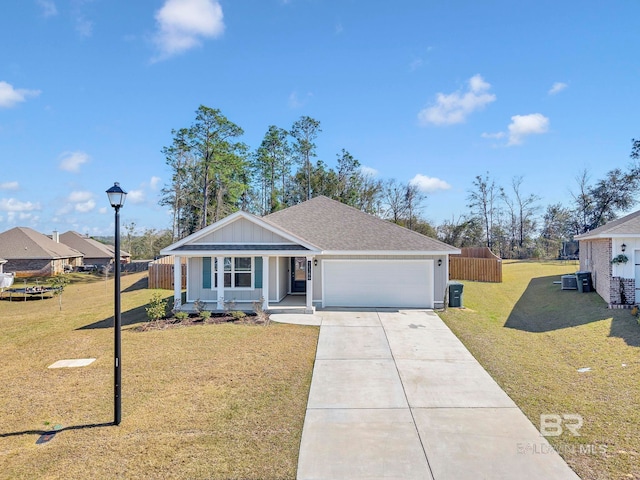 ranch-style home with a porch, an attached garage, driveway, roof with shingles, and a front yard