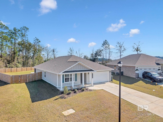 ranch-style house featuring roof with shingles, a porch, fence, driveway, and a front lawn